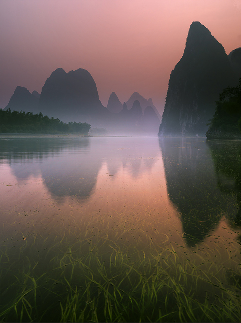 The Li River canyons. Ancient Lair of the Dragon, the archetypal landscape of China, a place of outstanding beauty and a culture...